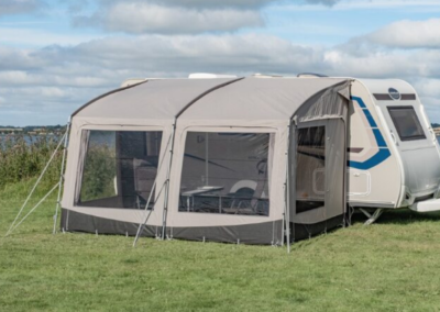 Lifestyle Image of a Telta Pace 390 pitched onto a caravan